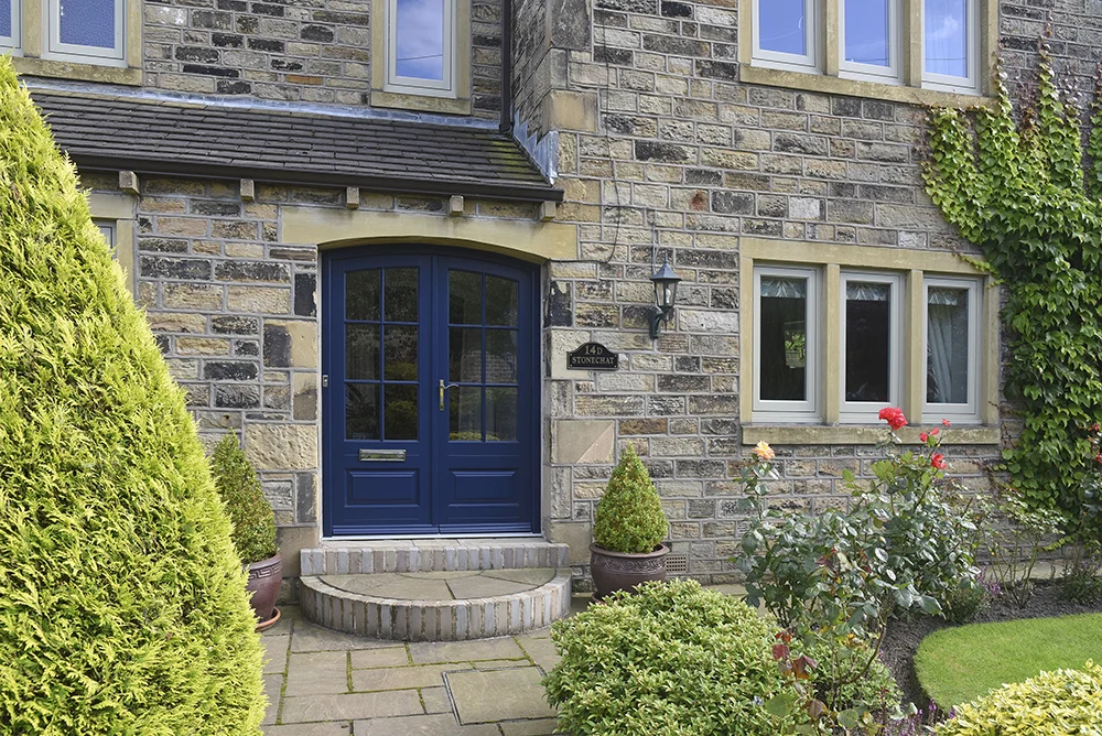 Bespoke-timber-Bardwell-double-entrance-door-finished-in-‘Oxford-Blue’-and-timber-flush-casement-windows-finished-in-‘French-Grey’