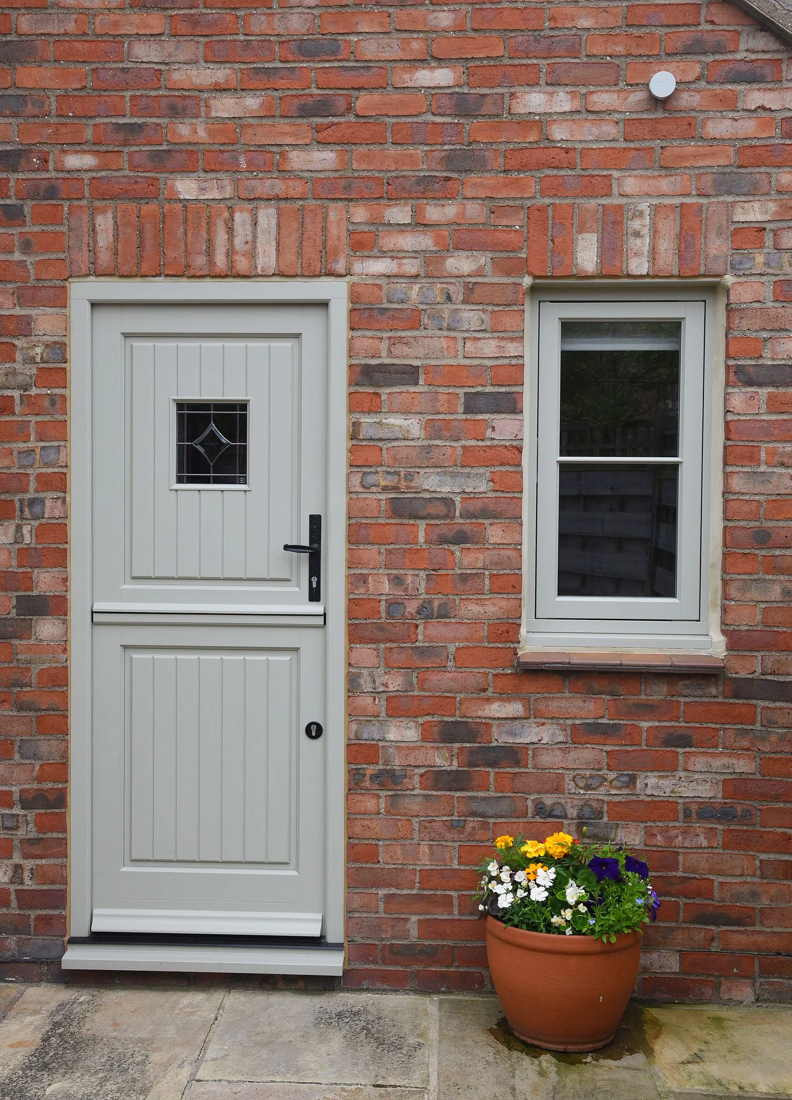 Staverton-stable-door-in-French-Grey-Bevel-glazing-details-Black-Kirkpatrick-handle