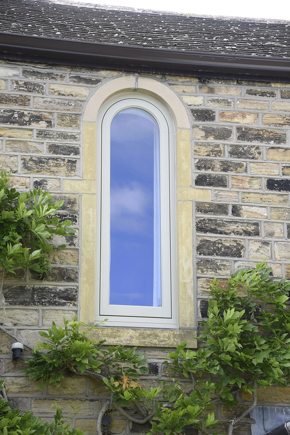Timber-Bespoke-arched-casement-window-finished-in-‘French-Grey’.-